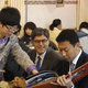Lew (at center of photo) dining with the people in Beijing.
